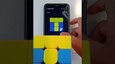 3 by 3 Rubik&#39;s Cube solved by the mobile phone with app unscramble